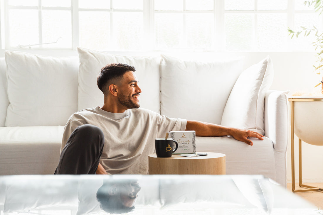 A happy, fit man relaxing with a coffee